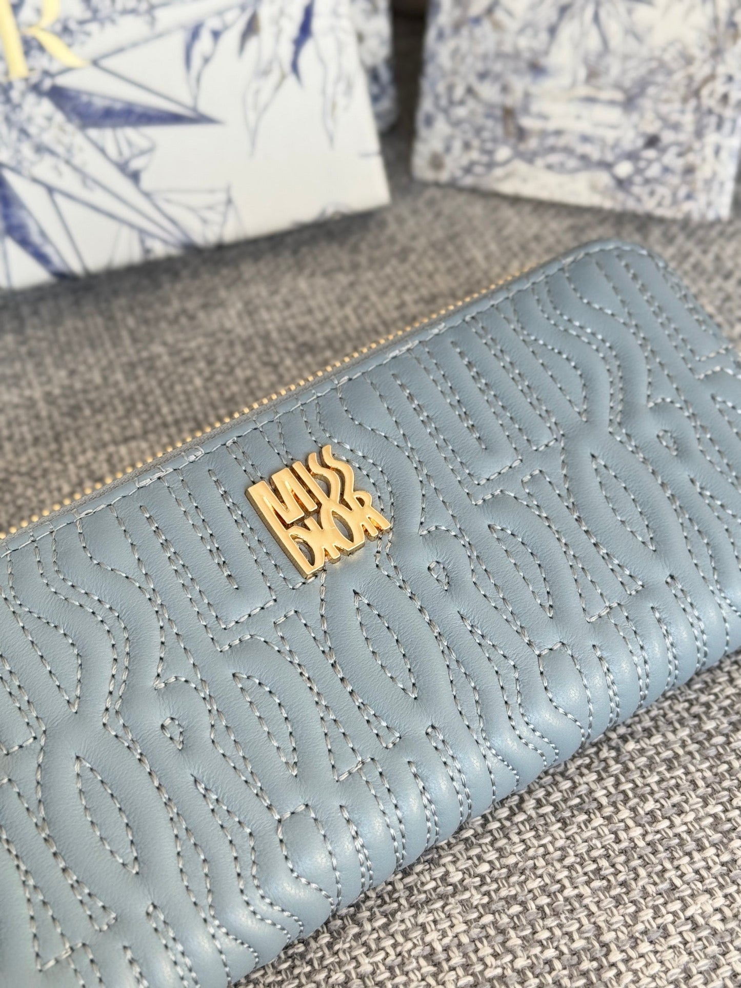 VERTICAL LONG ZIP WALLET 20 IN BABY BLUE QUILTED ALLOVER CALFSKIN